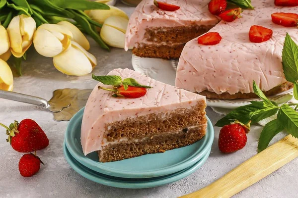 When serving, cut the cake into portions. A fragrant and cool mousse cake perfect for a hot summer, especially if you make your own strawberry mousse. Nobody will refuse a piece of such a dessert.