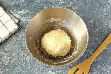 Knead a soft dough, put it in a ball, cover with a towel and let sit for 30 minutes.