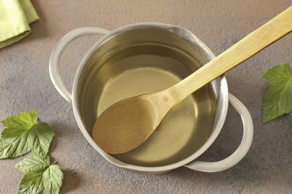 Pour sugar and salt into a saucepan. Pour in the liquid from the jar and let it boil again. When the brine boils, add the vinegar and immediately pour the boiling brine over the cucumbers. Tighten the jar tightly with metal lids or roll up.