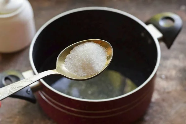 For the third time, drain the water into a saucepan, add salt and sugar. Boil for a minute, add vinegar, turn off heat.