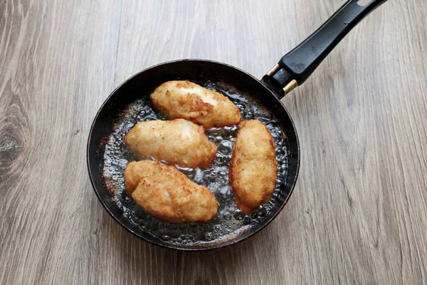Pour vegetable oil into a deep frying pan and heat. Put cutlets in it and fry on medium heat for 5-6 minutes on both sides. Transfer to a plate with a paper towel to remove excess oil. Then serve with any side dish.