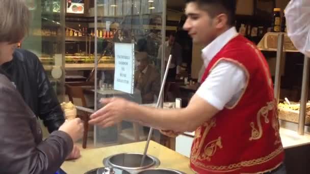Man packing bread at bread counter — Stock Video © Wavebreakmedia #130554518 Man packing bread at bread counter — Stock Video © Wavebreakmedia #130554518