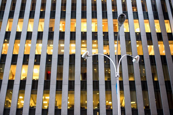 Lamp Post in the center of an architectural glass and skyscraper — Stock Photo, Image