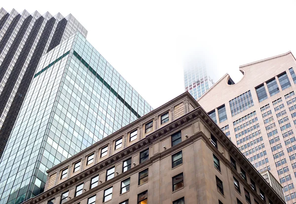 Skyscrapers rising up to sky on Manhattan — Stock Photo, Image