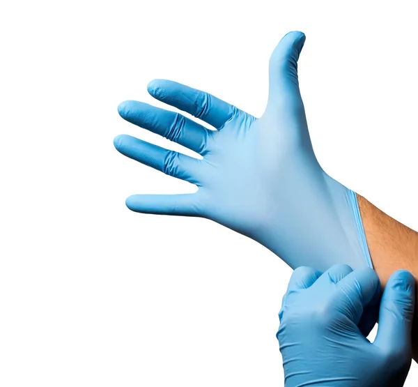 Doctor poniéndose guantes protectores, aislado — Foto de Stock