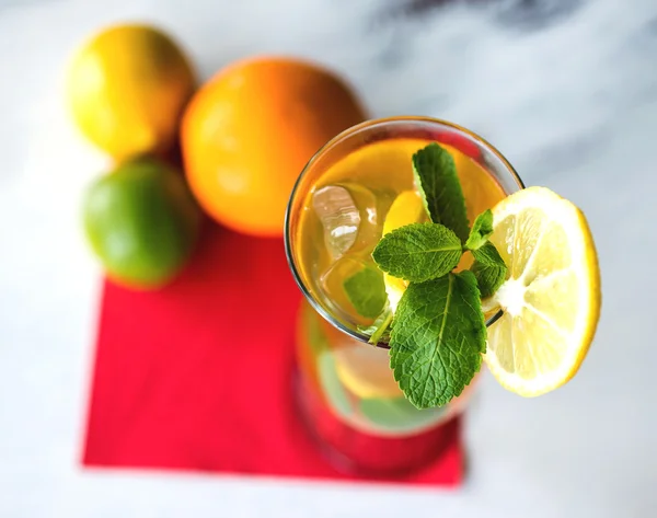 Iced drink with mint and citrus fruit. Selective focus