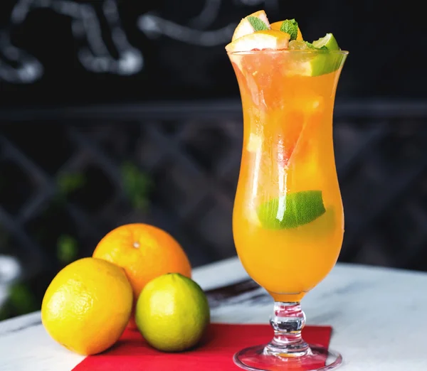 Orange cocktail on rustic wooden table.Selective focus — Stock Photo, Image