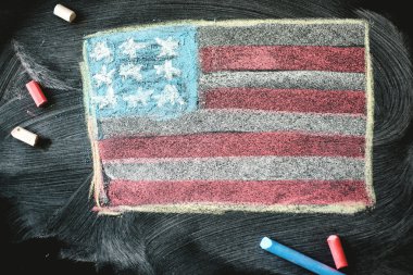 black chalkboard in classroom with flag of us clipart