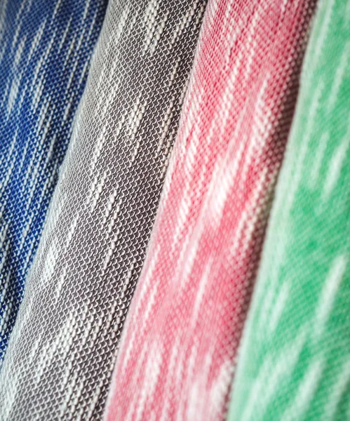 Rolls of colorful fabric as a vibrant background image — Stock Photo, Image