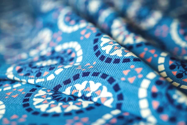 Blue fabric textile with ornament on wooden background — Stock Photo, Image