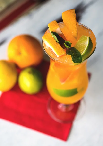 Refreshing lemonade with oranges and mint on wooden table. — Stock Photo, Image