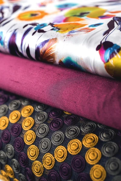 Rolls of colorful fabric as a vibrant background image — Stock Photo, Image