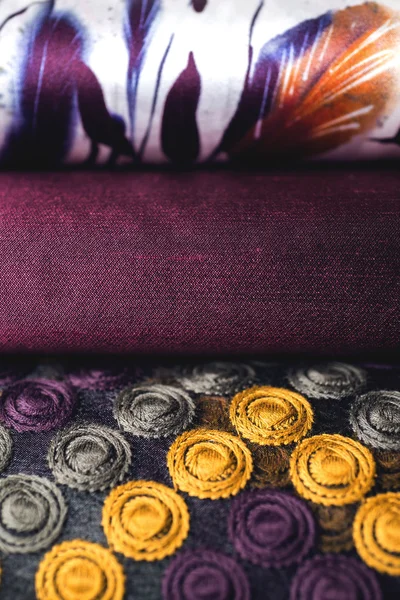 Rolls of colorful fabric as a vibrant background image — Stock Photo, Image