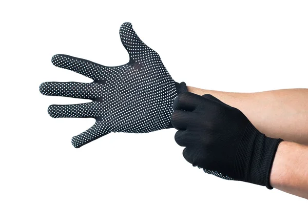 Constructor manos poner en guantes de trabajo negro. aislado — Foto de Stock