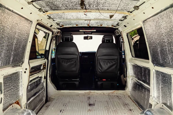 Conversion of a t4 van into a camper van.. Soundproofing and insulation have been added to the van ready for carpeting