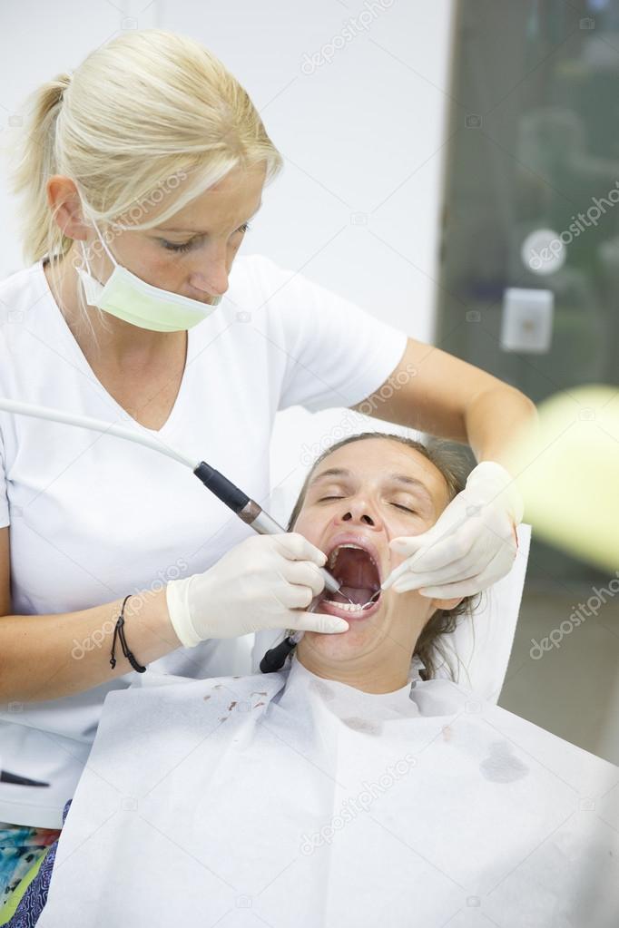 Patient and her dentist, doing a regular checkup