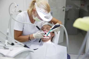 Woman at dental office clipart