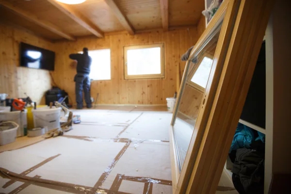 Worker installing new wooden windows — Stock Photo, Image