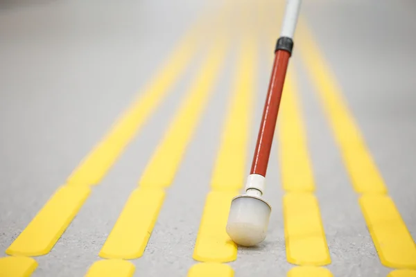 Blind pedestrian walking on tactile paving — Stock Photo, Image