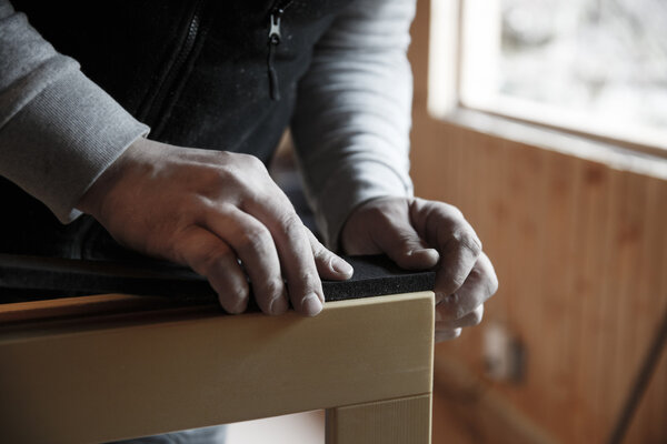 Worker preparing to install new wooden windows
