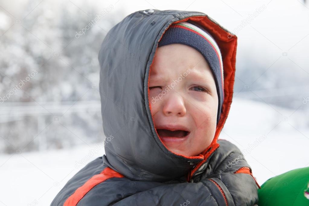 Little boy crying, not wanting to walk outside