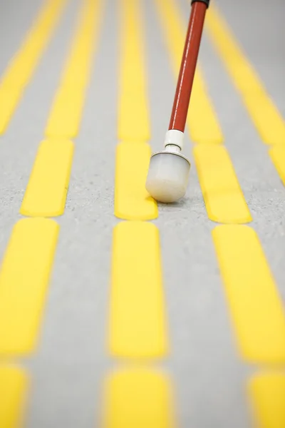 Blind pedestrian walking on tactile paving — Stock Photo, Image