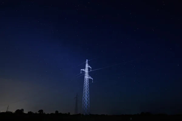 Pylon under starry sky — Stock Photo, Image