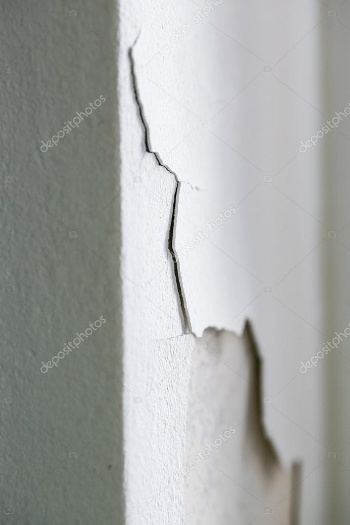 Cracking and peeling concrete wall