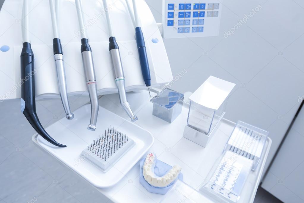 Dental treatment tools with nozzles