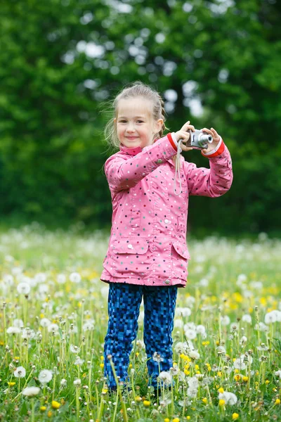 Little girl photographing with her camera — Stock Photo, Image