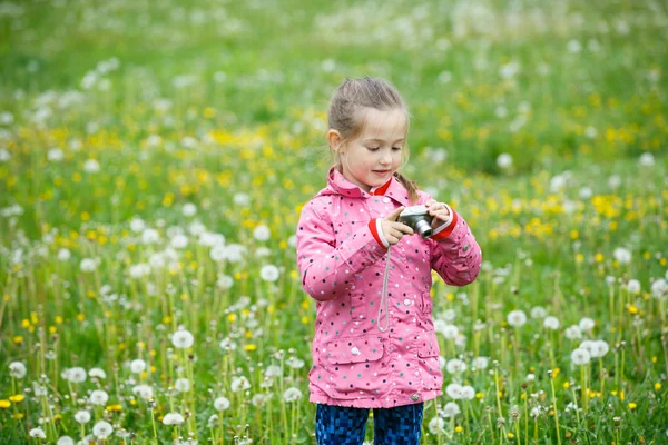 Little girl photographing with her camera — Stock Photo, Image