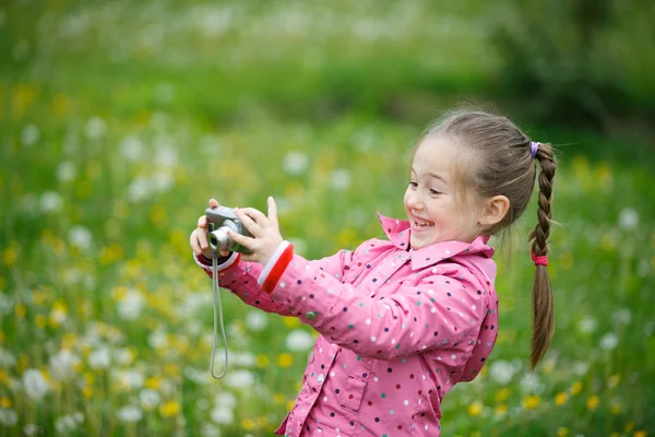 Little girl photographing with her camera — Stock Photo, Image