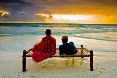 Romantic couple on tropical beach clipart