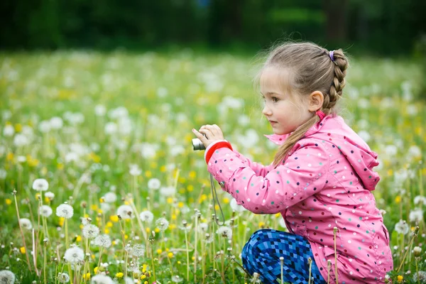 Little girl photographing with her camera — Stock Photo, Image