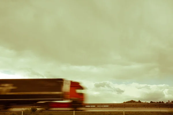 Blurred heavy truck on highway — Stock Photo, Image