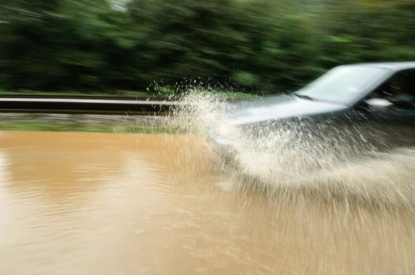 Driving the flooded road — Stock Photo, Image