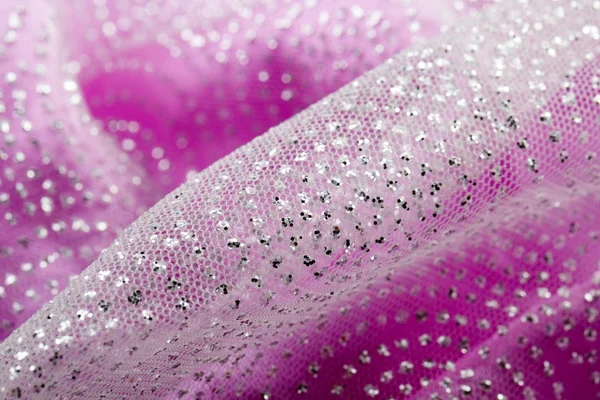Shiny glitter on pink fabric