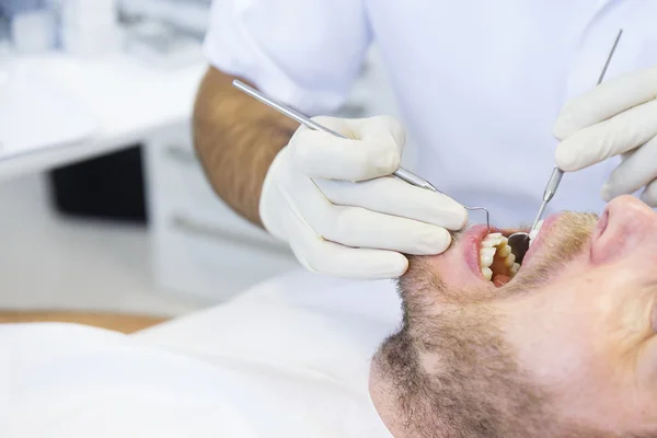 Patient in dental office on regular checkup — Stock Photo, Image