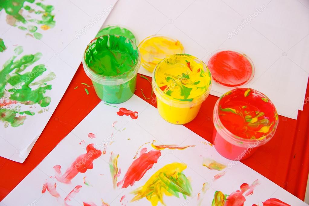 Finger paints in bright colors