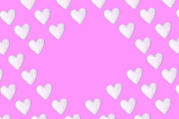 Pastel pink background with white hearts pattern with copy space. Minimal love art design.
