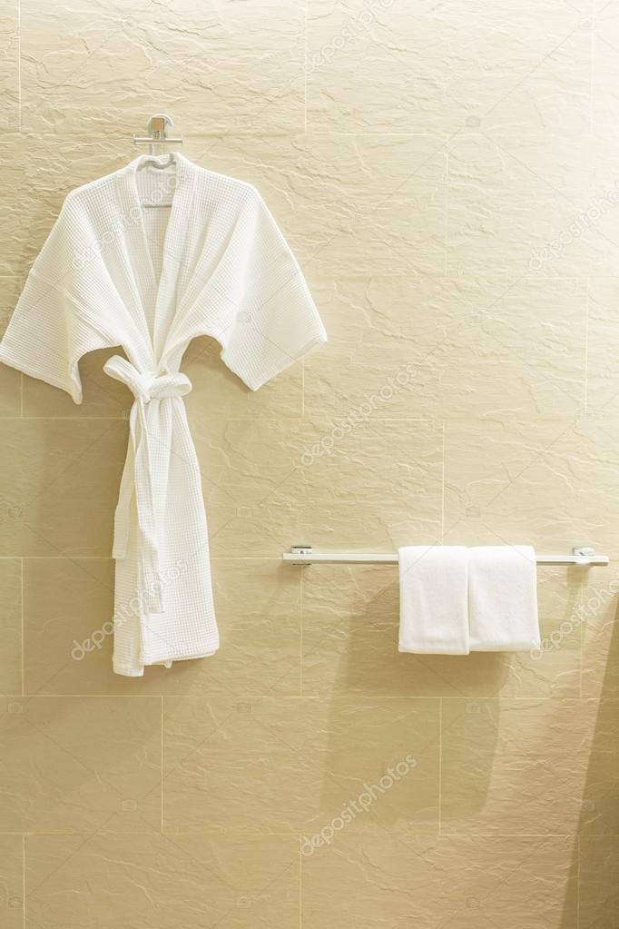 White shower gown and small towels 
