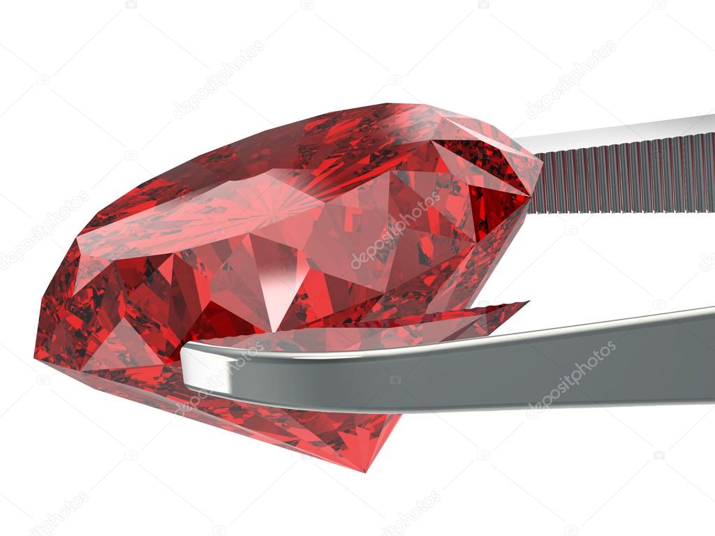 gem stone in tweezers isolated on a white background