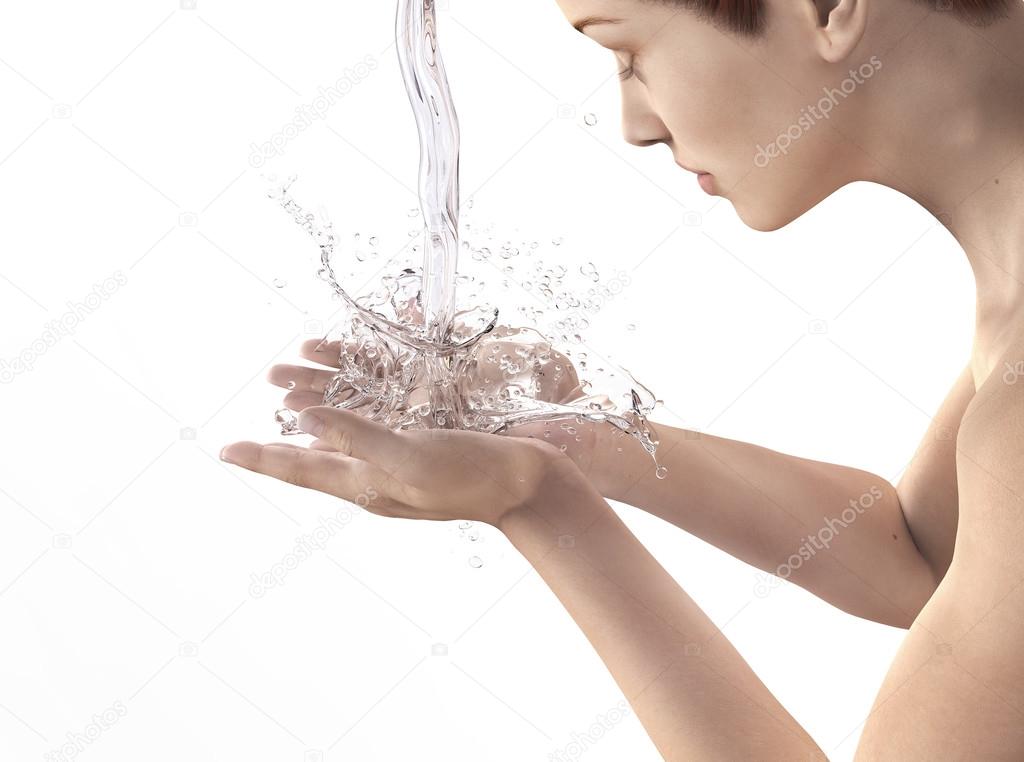 Beautiful woman washing her face isolated