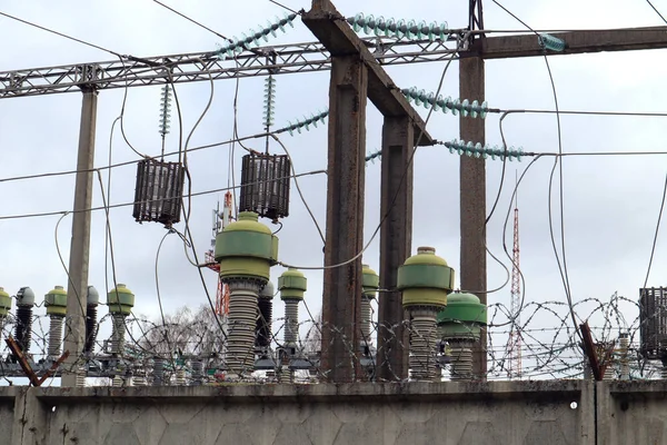 Power supply system equipment behind a concrete wall, close-up