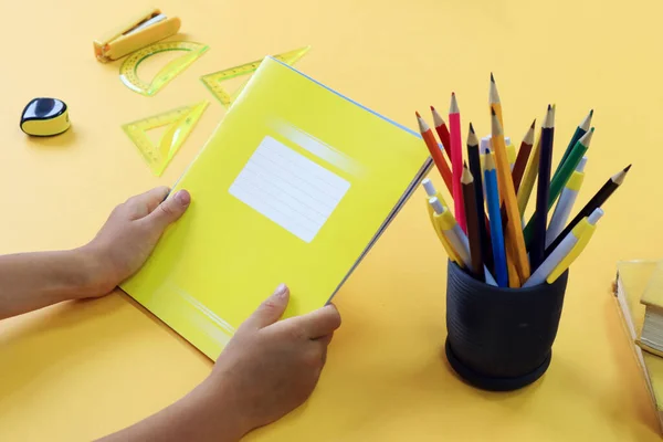 Concept School Education Stack Yellow Notebooks Hands Child Next Various — Stock Photo, Image