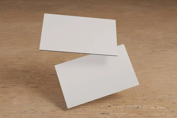 两张卡的3D渲染站在一边 在木制背景下漂浮 它可以用来向客户或其他人介绍你自己 — 图库照片
