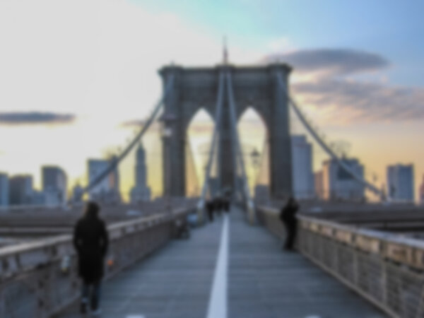 Defocused background with Brooklyn at sunset in New York, United States. Intentionally blurred post production for bokeh effect.