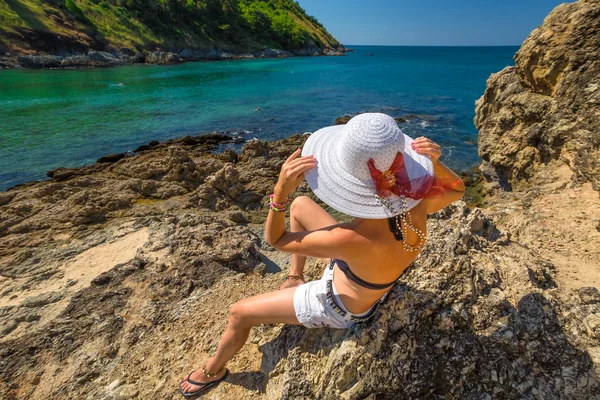 Woman sunbathing on the rocks — Stock Photo, Image