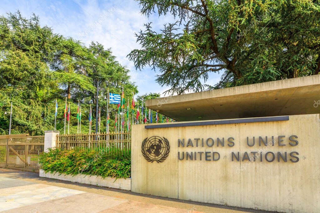 Geneva, Switzerland - Aug 16, 2020: signboard with Emblem at entrance of United Nations HQ or Palais des Nations in Ariana Park, by the lake Geneva. Since 1966 is the main European headquarters of UN.