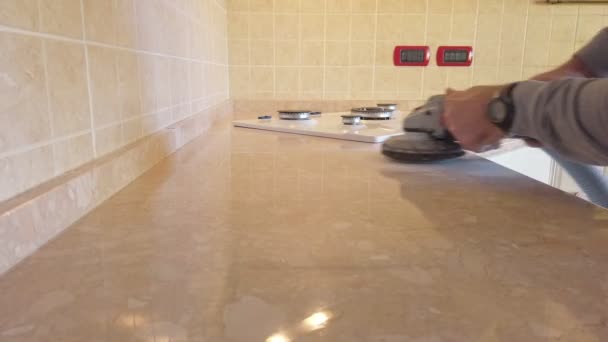 Pad sander tool sanding a kitchen top — Stock Video